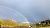 Regenbogen &uuml;ber dem Rursee und einem Teil des Nationalparks.